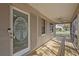 Inviting screened porch with wood flooring, perfect for relaxing at 1321 Riverside Dr, Tarpon Springs, FL 34689