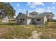 Side yard view of a single-story house at 1321 Riverside Dr, Tarpon Springs, FL 34689