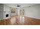 Living room with hardwood floors, fireplace, and access to backyard at 1321 Riverside Dr, Tarpon Springs, FL 34689