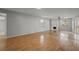 Bright and airy living room with hardwood floors and a cozy fireplace at 1321 Riverside Dr, Tarpon Springs, FL 34689