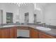 Double vanity bathroom with wood cabinets and gray countertops at 13745 Pimberton Dr, Hudson, FL 34669