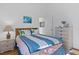 Bedroom with double bed and wood nightstand at 13745 Pimberton Dr, Hudson, FL 34669