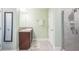 Bathroom with single vanity, shower, and linen closet at 14091 Gold Crest Rd, Weeki Wachee, FL 34614