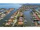 Picturesque aerial view of waterfront properties and neighborhood canals, with mature trees, boats, and homes at 1997 Kansas Ne Ave, St Petersburg, FL 33703
