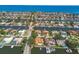 Expansive aerial showcases waterfront homes along canals, highlighting terracotta roofs and lush greenery throughout the neighborhood at 1997 Kansas Ne Ave, St Petersburg, FL 33703