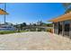 Backyard with a travertine patio, lush landscaping, a boat dock, and waterfront views at 1997 Kansas Ne Ave, St Petersburg, FL 33703