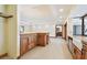 Modern kitchen design with stainless appliances, wooden cabinets, and breakfast bar at 1997 Kansas Ne Ave, St Petersburg, FL 33703