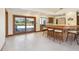 Spacious kitchen area featuring a breakfast bar with seating and sliding glass doors to the outdoor patio at 1997 Kansas Ne Ave, St Petersburg, FL 33703