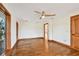 Spacious living room featuring hardwood floors, neutral walls, wood trim, and natural light at 1997 Kansas Ne Ave, St Petersburg, FL 33703