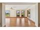 Bright living room featuring hardwood floors, neutral walls, wood trim, recessed lighting, and natural light at 1997 Kansas Ne Ave, St Petersburg, FL 33703