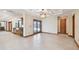 Light-filled living room with tile floors and water views from sliding glass doors at 1997 Kansas Ne Ave, St Petersburg, FL 33703