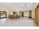 A large living area with a wet bar, recessed lights, and tiled flooring at 1997 Kansas Ne Ave, St Petersburg, FL 33703
