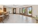 A large living area with a wet bar, recessed lighting, tiled flooring and a custom door at 1997 Kansas Ne Ave, St Petersburg, FL 33703