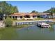Waterfront property with travertine patio, boat dock, and beautiful landscaping, creating a tranquil setting at 1997 Kansas Ne Ave, St Petersburg, FL 33703