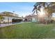 Landscaped backyard with large pool and lawn at 2012 Carolina Ne Cir, St Petersburg, FL 33703