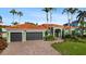 Mediterranean style home with tile roof and landscaping at 2012 Carolina Ne Cir, St Petersburg, FL 33703