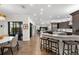 Modern kitchen with dark cabinetry, granite countertops, and breakfast bar at 2012 Carolina Ne Cir, St Petersburg, FL 33703