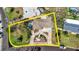 Attractive single-story home with a circular driveway and a pool at 209 Westwinds Dr, Palm Harbor, FL 34683