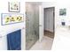 Bathroom with pebble tile shower and glass enclosure at 209 Westwinds Dr, Palm Harbor, FL 34683