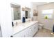 Updated bathroom with double vanity, and a walk in shower at 209 Westwinds Dr, Palm Harbor, FL 34683