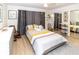 Bright bedroom with mirrored closet doors and ceiling fan at 209 Westwinds Dr, Palm Harbor, FL 34683