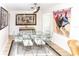 Charming dining room with a glass-top table and light-colored chairs at 209 Westwinds Dr, Palm Harbor, FL 34683