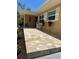 Inviting front entrance with a tiled walkway, white chairs, and decorative flower planters, adding charm and curb appeal at 209 Westwinds Dr, Palm Harbor, FL 34683