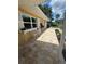 Inviting front entrance with a tiled walkway and decorative flower planters, adding charm and curb appeal at 209 Westwinds Dr, Palm Harbor, FL 34683