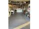 Spacious garage with ample storage and workbench area at 209 Westwinds Dr, Palm Harbor, FL 34683
