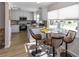Modern kitchen with white cabinets, granite countertops, and stainless steel appliances at 209 Westwinds Dr, Palm Harbor, FL 34683