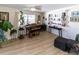 Living room with hardwood floors, built-in shelving, and a grand piano at 209 Westwinds Dr, Palm Harbor, FL 34683