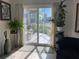 Bright living room featuring hardwood floors, and sliding glass doors to a patio at 209 Westwinds Dr, Palm Harbor, FL 34683