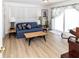 Living room with blue sofa and sliding glass doors at 209 Westwinds Dr, Palm Harbor, FL 34683