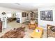 Spacious living room featuring hardwood floors, comfortable seating, and large windows at 209 Westwinds Dr, Palm Harbor, FL 34683