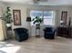 Bright living room featuring neutral walls, hardwood floors, and natural light at 209 Westwinds Dr, Palm Harbor, FL 34683