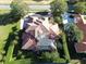Luxury home with tile roof and large pool, seen from above at 3050 Wentworth Way, Tarpon Springs, FL 34688