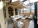 Covered balcony with seating area and view at 3050 Wentworth Way, Tarpon Springs, FL 34688