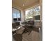 Balcony with outdoor seating and views of lush landscaping at 3050 Wentworth Way, Tarpon Springs, FL 34688