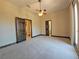 Spacious bedroom with carpeted flooring and ceiling fan at 3050 Wentworth Way, Tarpon Springs, FL 34688