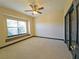 Cozy bedroom with carpeted floors, window seat, and ample natural light at 3050 Wentworth Way, Tarpon Springs, FL 34688
