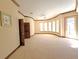 Large bedroom with curved wall and multiple windows at 3050 Wentworth Way, Tarpon Springs, FL 34688
