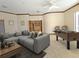 Bonus room with sectional sofa, foosball table, and carpeted flooring at 3050 Wentworth Way, Tarpon Springs, FL 34688