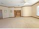 Spacious bonus room with carpeted flooring and curved wall at 3050 Wentworth Way, Tarpon Springs, FL 34688