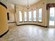 Bright breakfast nook with tile floors and large windows overlooking the backyard at 3050 Wentworth Way, Tarpon Springs, FL 34688