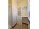 Walk-in closet with built-in shelving, drawers, and hanging rods at 3050 Wentworth Way, Tarpon Springs, FL 34688