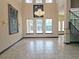 Spacious dining room with hardwood floors, large windows, and chandelier at 3050 Wentworth Way, Tarpon Springs, FL 34688