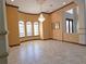 Elegant dining room with chandelier, large windows, and tile flooring at 3050 Wentworth Way, Tarpon Springs, FL 34688