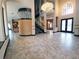 Spacious foyer with tiled flooring, spiral staircase, and high ceilings at 3050 Wentworth Way, Tarpon Springs, FL 34688