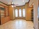 Spacious home office features built-in shelving and large windows at 3050 Wentworth Way, Tarpon Springs, FL 34688