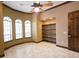 Bright home office with hardwood floors and ceiling fan at 3050 Wentworth Way, Tarpon Springs, FL 34688